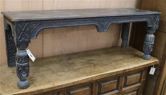 A Victorian carved oak bench W.117cm